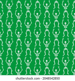 Seamless pattern with white skeletons on a green background