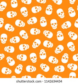 Seamless pattern white skulls on a orange background