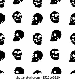 Seamless pattern with white skulls on a black background.