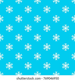 Seamless pattern with white snowflakes