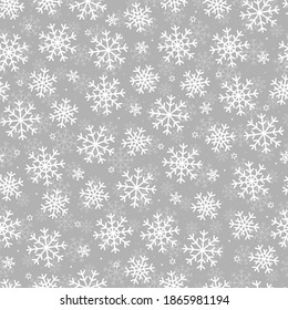 Seamless pattern white snowflakes. Christmas design. Picture for printing, packaging paper and new year's textiles.
