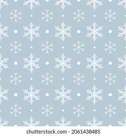 Seamless pattern with white snowflakes and dots on blue background. Festive winter traditional decoration for New Year, Christmas, holidays and design. Ornament of simple line