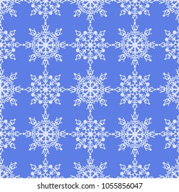 Seamless pattern of white snowflakes on blue background.