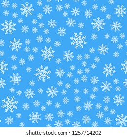 Seamless pattern. White snowflakes on a blue backgrounds. For packaging paper