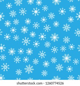 Seamless pattern. White snowflakes on a blue backgrounds. For packaging paper