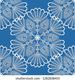 seamless pattern with white snowflakes on a blue background