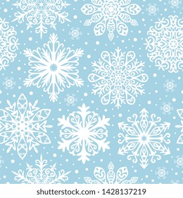 Seamless pattern with white snowflakes on blue background. Winter background for Christmas, Noel, New Year.