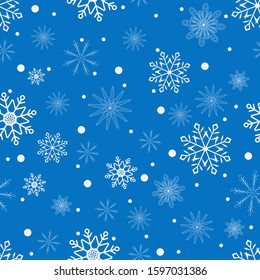 
Seamless pattern with white snowflakes on a blue background. Vector.