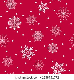 Seamless pattern. White snowflakes on a red background. New Year. Vector.