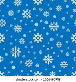 El patrón impecable con los copos de nieve blancos sobre el fondo azul. El ahorro con la máscara de recorte.