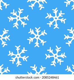 Seamless pattern of white snowflakes on a blue background. Vector pattern of a white snowflake drawn in the style of a doodle with white contour randomly placed on a blue background for a winter 