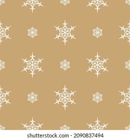 Seamless pattern of white snowflakes on a beige background
