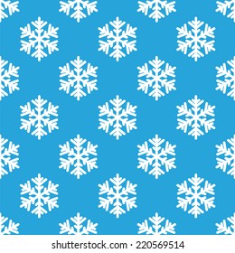 Seamless pattern of white snowflakes on a blue background