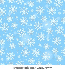 Seamless pattern white snowflakes on blue background. Happy New Year.