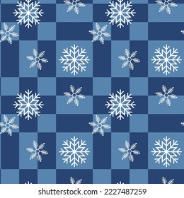 seamless pattern with white snowflakes on blue checkered pattern. Cosy pattern for christmas and new year decorations, packaging, wrapping papers, box designs, holiday clothes and interior decor. 