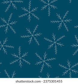 Seamless pattern of white snowflakes on dark blue background. Night winter sky with snow falling.