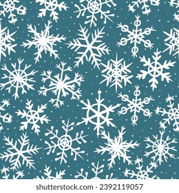 Seamless pattern with white snowflakes on a blue background. Hand-drawn snowflakes. Pattern for winter and Christmas design. Vector illustration.