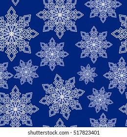 Seamless pattern white snowflakes on blue dark background. Vector