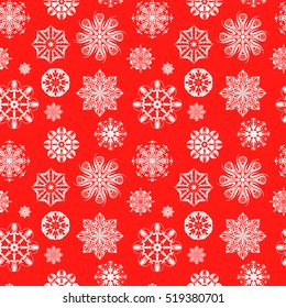Seamless pattern. White snowflakes on a red background. Celebratory background to the Christmas and New Year