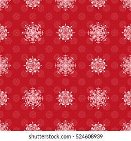 Seamless pattern. White snowflakes on a red background. Celebratory to the Christmas and New Year.