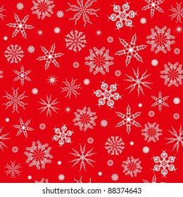Seamless pattern. White snowflakes on a red background.