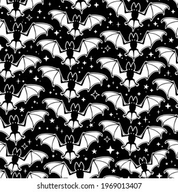 seamless pattern of white soaring bats on a black background