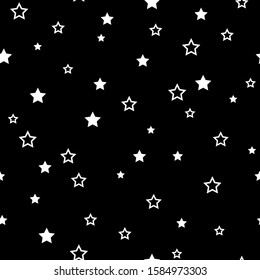 The seamless pattern with white stars on a black background. Vector.
