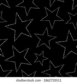 Seamless pattern of white stars on a black background