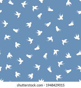 Seamless pattern with white swallow silhouette on blue background. Cute bird in flight. Vector illustration.  Doodle style. Design for invitation, poster, card, fabric, textile.