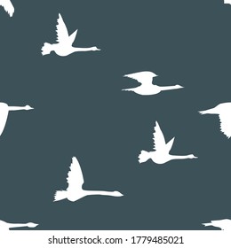 
seamless pattern with white swans on gray-blue background