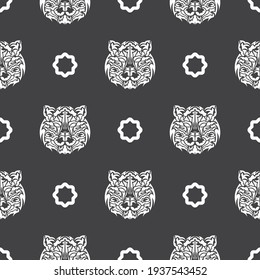 Seamless pattern with white tiger face in boho style. Polynesian style tiger face. Good for backgrounds and prints. Vector 