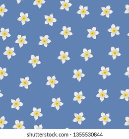 Seamless pattern with white tropical flowers on blue background

