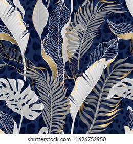 Seamless pattern with white tropical  leaves with gold elements on  blue leopard background. 