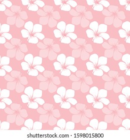Seamless pattern of white vinca flowers on pink background