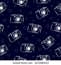 seamless pattern white vintage camera on a blue background with stars