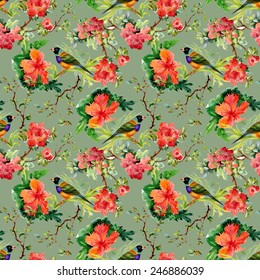 Seamless pattern with wild exotic birds on the branch with flowers on green background vector illustration