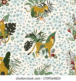 Seamless pattern with wild jungle cheetahs’ animals in different poses and exotics floral and leaves. Tropical cats with leopard print skin. Great for wrap paper, wallpapers, web page, surface textile