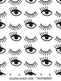 Seamless pattern with winking eyes in black and white.