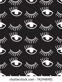 Seamless pattern with winking eyes in black and white.