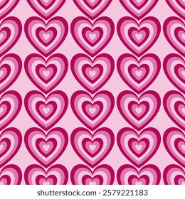 Seamless pattern wint hearts in pink colours on a light pink background. Vector Valentine's Day background.