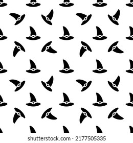 Seamless pattern with a witches hat on a red background. Vector illustration for Halloween design