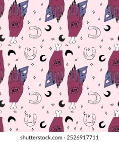seamless pattern with witch's hands, moons and horseshoes.