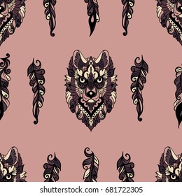 Seamless pattern with wolf and feathers in ethnic style - colorful art on a pink background