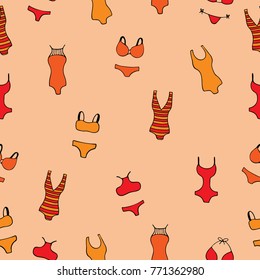 Seamless pattern with women's bathing suits on a peach background.