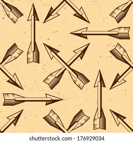 Seamless pattern with woodcut vintage arrows on grungy paper