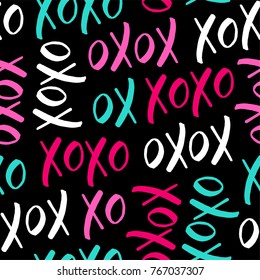 Seamless Pattern With Word “xoxo” On Black Background