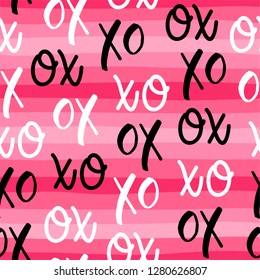 Seamless pattern of word XOXO with pink stripes background for valentine's day.