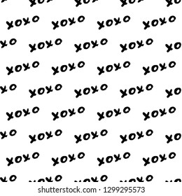 Seamless pattern XOXO on white background. Grunge hand written brush lettering XO. Hugs and kisses abbreviation symbol. Easy to edit template for Valentine’s day. Vector illustration.