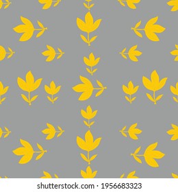 Seamless pattern of yellow abstract flowers, leaves on a gray background. The fashionable color combination of 2021