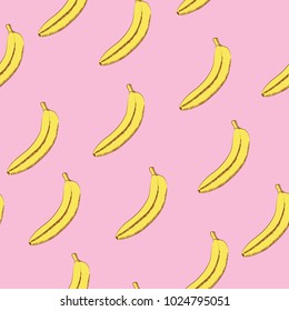 Seamless pattern of yellow bananas on a pink background.